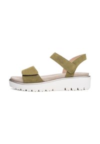 Green suede sandal with two adjustable straps and a cushioned footbed. Features a white, textured rubber sole with a tread pattern.