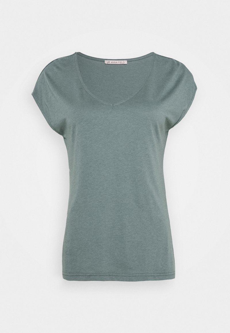 Green short-sleeve t-shirt made of soft fabric. Features a v-neck design and a relaxed fit with a smooth texture.