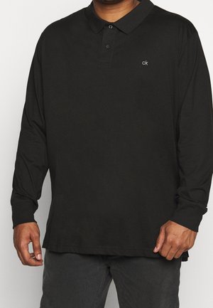 Schwarzes Langarm-Polohemd aus Baumwolle, mit umgeschlagenem Kragen, Knopfverschluss und einem kleinen bestickten "ck"-Logo auf der Brust.