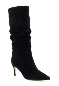 Black suede knee-high boot with slouchy upper, pointed toe, and a slender heel. Smooth texture with no visible patterns or hardware.