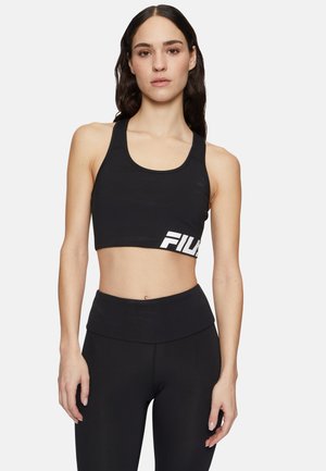 Top corto nero con scollo tondo e logo Fila bianco sul lato sinistro. Il materiale sembra liscio con un design aderente.