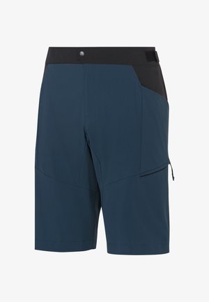 Pantaloni corti blu navy con una cintura nera, caratterizzati da una tasca laterale con zip e una superficie liscia. Realizzati in un materiale leggero e resistente.