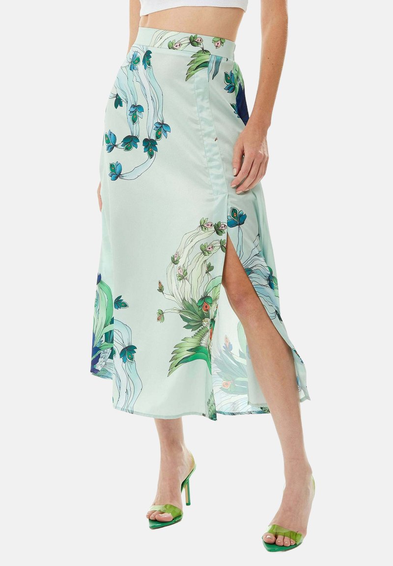 Light green satin skirt with floral pattern, high slit on one side, and a fitted waist. Accented with colorful floral details and a smooth texture.