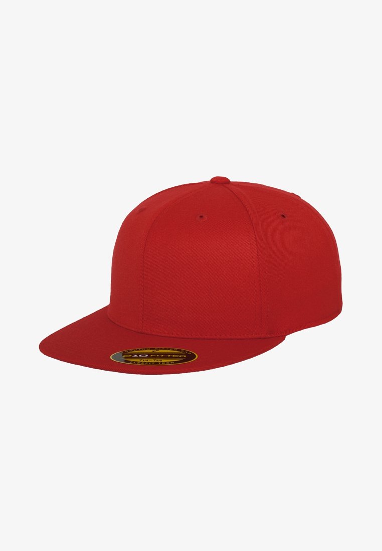 Red baseball cap made of textured fabric, featuring a flat brim and a solid color design. Includes a circular logo sticker on the brim.