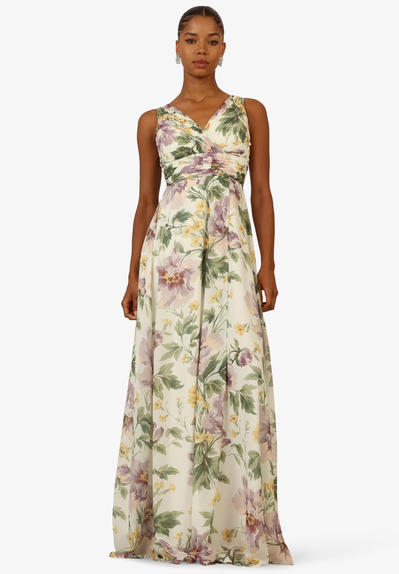 Langes Blumenkleid mit einem Wickeloberteil in Lavendel-, Gelb- und Grüntönen, aus leichtem Stoff mit einem fließenden Rock.