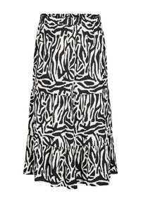 Jupe à volants noir et blanc avec un motif zèbre, confectionnée en tissu léger avec une finition texturée.