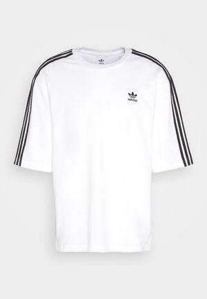 White short-sleeve t-shirt with black three-stripe design on shoulders and black Adidas logo on the chest. Soft cotton material.