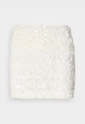 White textured fabric with clustered sequins, featuring a soft, fluffy appearance. Rectangular shape with an even surface.