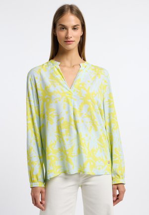 Long-sleeve blouse in pale blue and yellow with an abstract floral print, V-neckline, and subtle button detail on the sleeve cuffs.