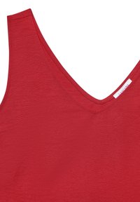 Red sleeveless top with a deep V-neck. Made of smooth fabric, featuring a clean, minimal design and visible stitching details.