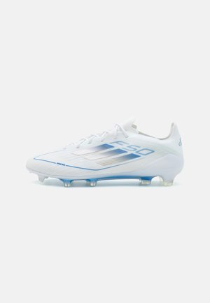 White soccer cleat with a streamlined design, featuring blue accents and textured fabric, clear plastic studs, and a snug lace-up closure.
