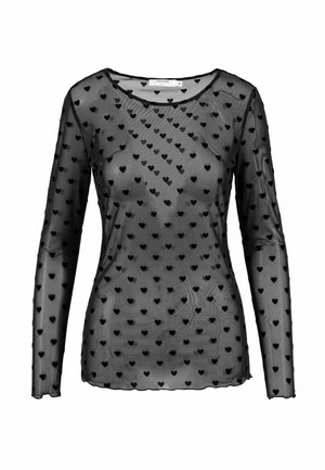 Haut noir transparent à manches longues, recouvert de petits motifs de cœurs en velours noir et à encolure ronde.