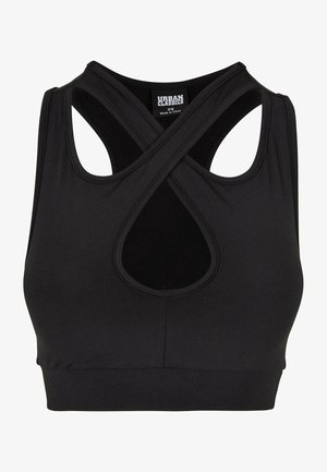 Svart sportbh tillverkad av elastiskt material, med en korsad baksida och utskärningdetaljer. Slät textur och åtsittande form.