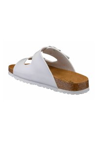 White slip-on sandal with a smooth synthetic upper, two cutouts, and a textured cork footbed. White rubber outsole with a patterned tread.