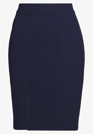 Jupe crayon bleu marine en tissu extensible, offrant une coupe slim et une fente latérale discrète, avec des lignes épurées et sans quincaillerie visible.