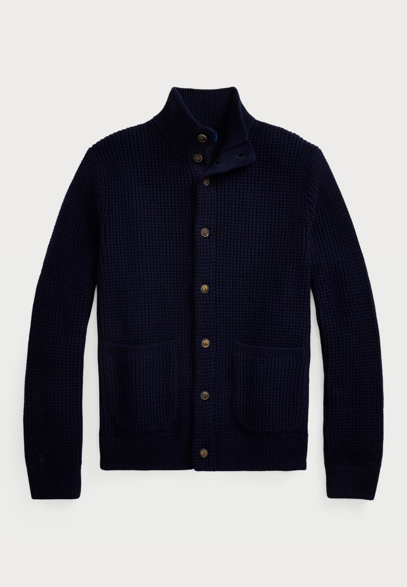 Cardigan tricoté bleu marine avec un col haut, fermeture à boutons et deux poches avant. Présente un motif texturé et des poignets côtelés.