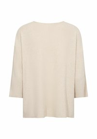 Ljus beige, ribbad stickad topp med lös passform, breda 3/4 ärmar och rundad halsringning. Ingen synlig märkning eller utsmyckningar.