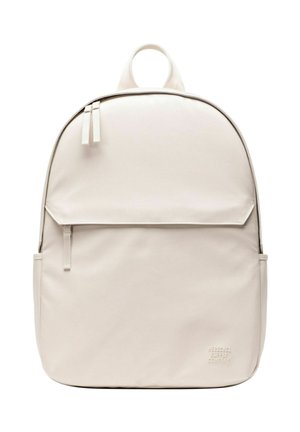 Sac à dos beige clair minimaliste avec poche avant zippée, doubles tirettes, poignée supérieure et logo discret de Herschel Supply Company.