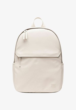 Sac à dos beige clair minimaliste avec poche avant zippée, doubles tirettes, poignée supérieure et logo discret de Herschel Supply Company.