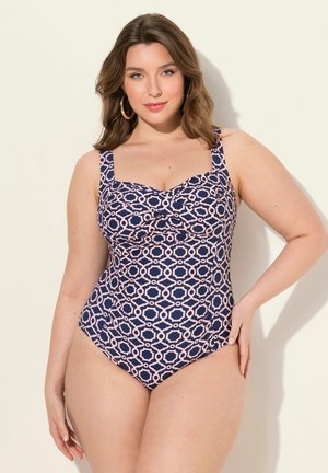 Maillot de bain une pièce marine avec un motif géométrique rose. Il dispose de bretelles larges et d'un design à devant torsadé pour plus de détails et de soutien.