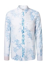 Cameretta a maniche lunghe blu e bianca con motivi floreali e paisley, dotata di taschino sul petto, colletto con bottoni e tessuto testurizzato.