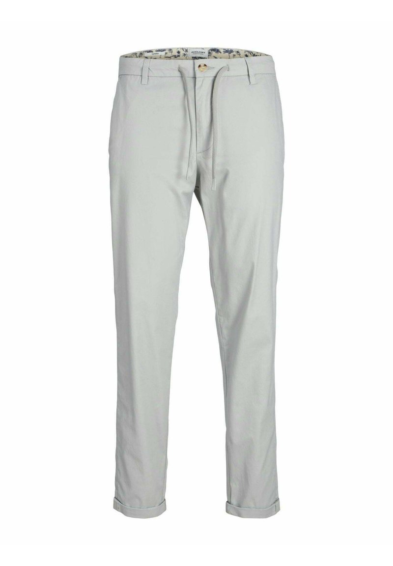 Pantaloni grigi chiari con una vestibilità slim, realizzati in cotone, con chiusura a bottone e orli arrotolati. Delicato motivo floreale all'interno della vita.