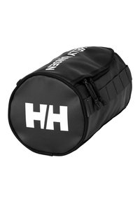 Svart sylinderformet bag laget av slitesterkt materiale, med hvit "HH" logo og solid glidelås, samt sideløkker for enkel håndtering.