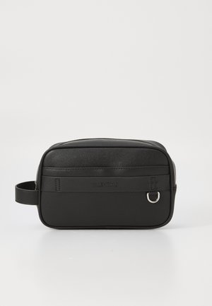 Black leather rectangular bag with textured surface, front strap with embossed logo, and side handle. Features a zip closure and metallic hardware.