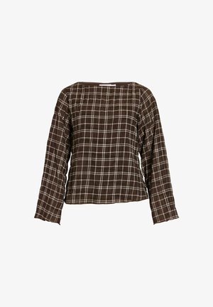 Blouse marron à manches longues avec motif à carreaux blancs en grille et col carré, présentée sur un fond blanc.