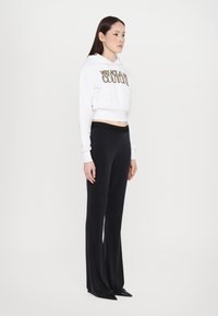 Versace Jeans Couture Leggings - Trousers - black
