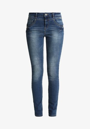 Skinny jeans in dark blue denim with a faded wash. Features five pockets, a zip fly, and subtle stitching accents on pocket seams.