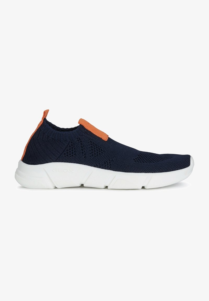 Navy knitted sneaker with orange accent, slip-on design, white rubber sole, textured mesh upper, and heel tab for easy wear.