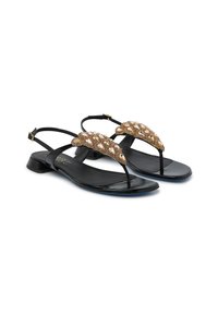 Sandali neri piatti con design a T, caratterizzati da una parte superiore decorativa in perline marrone dorato e un tacco minimale.