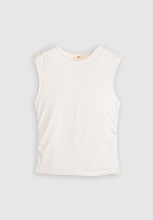 Bela brezrokavna majica iz mehkega blaga, ki ima gubanec na straneh in okroglo ovratnico. Ima gladko teksturo in prilegajoč obliko.