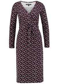 Marinblå omlottklänning med lång ärm, med ett flerfärgat abstrakt mönster. Tillverkad av mjukt tyg med ett bälte vid midjan för en justerbar passform.