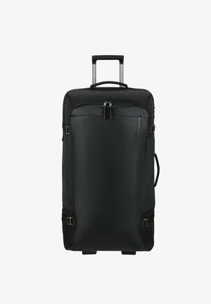 Valise à roues noires avec une surface texturée, fermeture à double zip, poignée extensible et sangles latérales pour la compression. Roues en caoutchouc lisses.