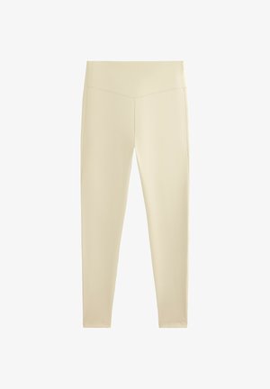 Leggings beige a vita alta con dettaglio di cucitura a forma di V in vita, esposti su uno sfondo bianco.