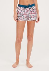 Shorts de bain avec un motif géométrique coloré dans les tons rose, bleu et blanc. Dotés d'une taille élastique avec un cordon de serrage teal.