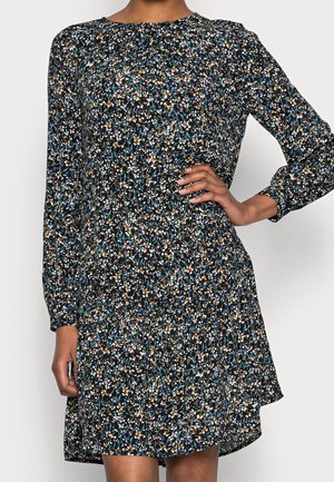 Vestido negro de flores con mangas largas, que presenta un patrón disperso en azul, blanco y marrón. Corte recto y acabado de tejido suave.