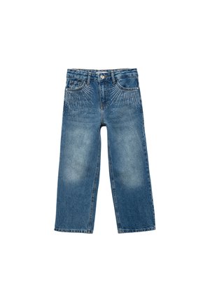 Pantalones vaqueros anchos de mezclilla en azul medio con acabado desgastado. Presenta decoloraciones y tachuelas metálicas decorativas dispuestas en un patrón radial.