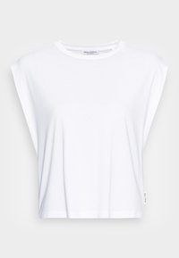 T-shirt bianco cropped realizzato in morbido cotone. Presenta un colletto rotondo e un design senza maniche con una vestibilità ampia. Discreta etichetta del marchio sul lato.