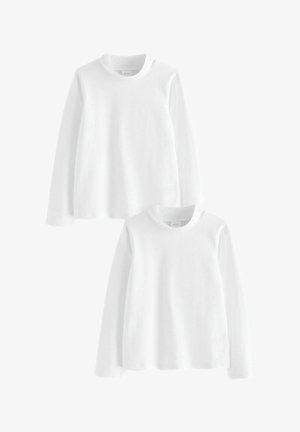 Bílé dlouhé trička s dlouhým rukávem naskládaná, s kulatým výstřihem a měkkou bavlněnou tkaninou. Jednoduchý design bez vzorů nebo akcentů.