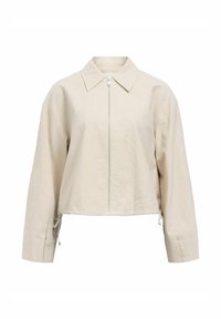Giacca beige crop con colletto aperto, chiusura frontale con zip e maniche lunghe. Presenta dettagli con lacci regolabili sull'orlo.