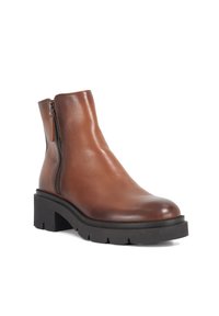 Brown leather ankle boot with a smooth finish, side zipper, and chunky black rubber sole featuring a textured tread pattern.