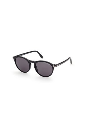 Black round sunglasses with dark lenses. Made of plastic with a smooth finish. Features metallic accenting on the arms, displaying the brand name.