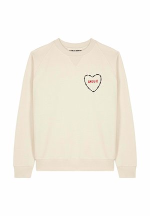 Felpa beige con scollo rotondo e maniche raglan. Presenta una grafica a forma di cuore con la scritta "AMOUR" in rosso sul petto a sinistra.