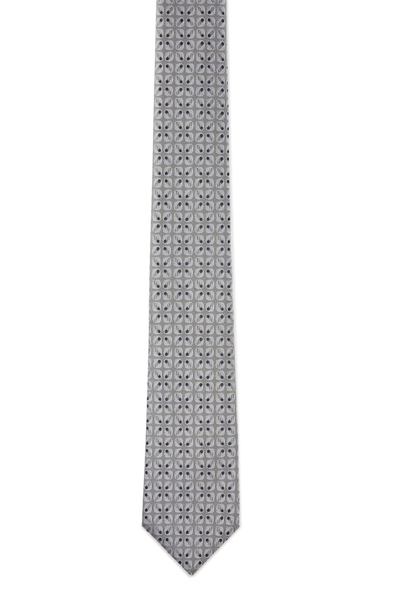 Cravate grise avec un motif géométrique, présentant des formes claires et foncées alternées. Texture lisse, forme étroite et design à extrémité pointue.