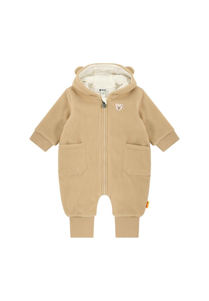 Beige fleeced baby onesie met een capuchon, berenoren, een voorrits, twee voorzakken en een beren appliqué. Zachte textuur, elastische manchetten.
