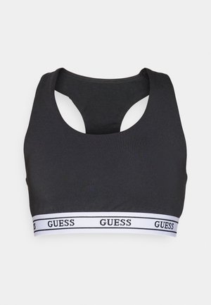 Top desportivo preto com um design de costas nadadeira, feito de um tecido suave. Apresenta uma faixa branca com "GUESS" impresso repetidamente.