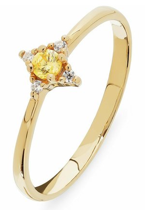 Goldring mit einem gelben zentralen Stein, umgeben von kleineren klaren Steinen, mit einem glatten Band und einem schlichten Design der Fassung.